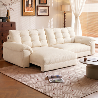 Cream chenille power sofa bed in a living room