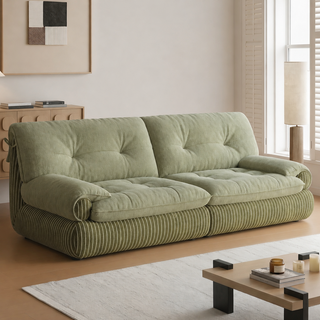 Green chenille sofa in a living room