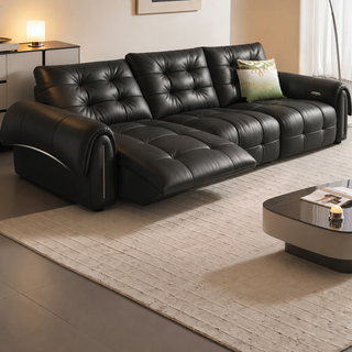 Black leather power sofa in a living room