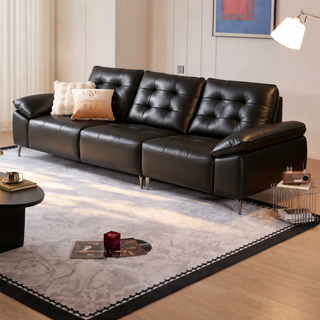 Black leather sofa in a living room