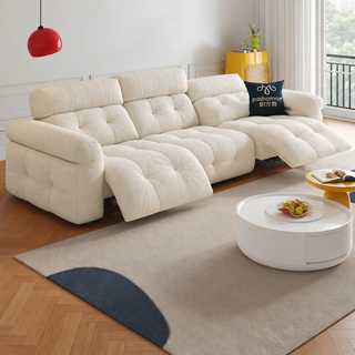 Cream chenille power recliner sofa in a living room