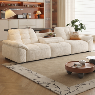 Cream waffle-tufted sofa with flip-down table in a living room