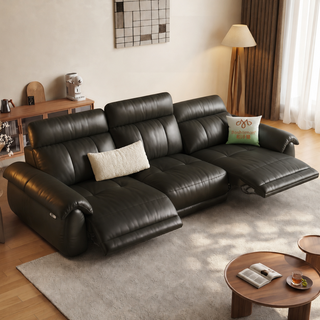 Dark brown leather power recliner sofa in a living room