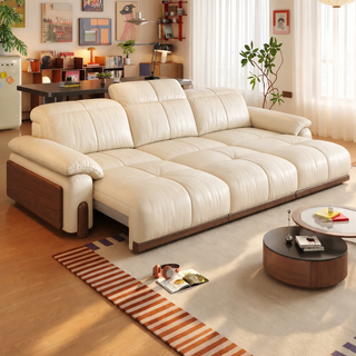 Cream leather power sofa bed in a living room
