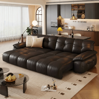 Black leather power sofa bed in a living room