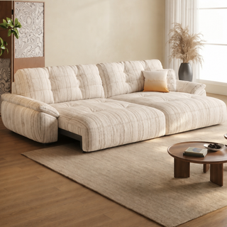 Striped fabric power sofa bed in a living room