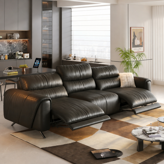 Black leather power recliner sofa in a living room