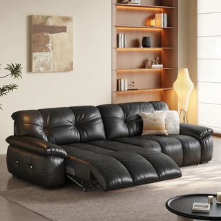 Black leather power recliner sofa in a living room