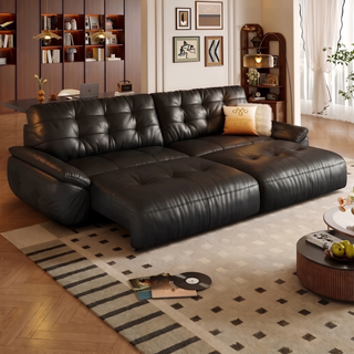 Black leather power sofa bed in a living room