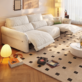 Cream chenille power recliner sofa in a living room