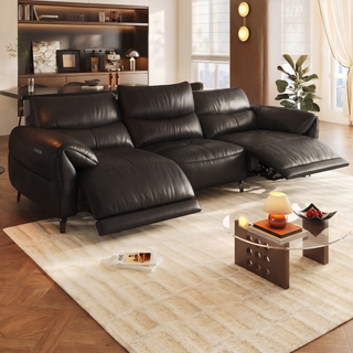 Black leather power recliner sofa in a living room