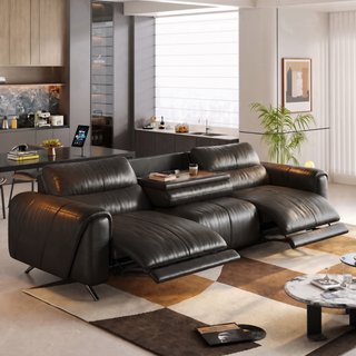 Black leather power recliner sofa in a living room