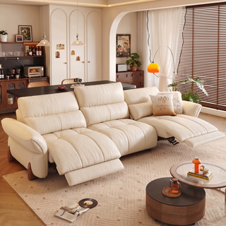 Cream leather power recliner sofa in a living room