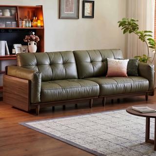 Olive-green leather sofa in a solid wood frame