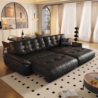 Black leather power sofa bed in a living room