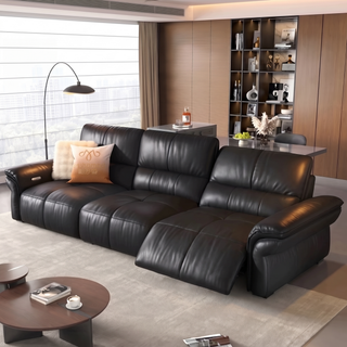 Black leather power recliner sofa in a living room