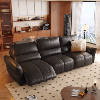 Black leather power recliner sofa in a living room