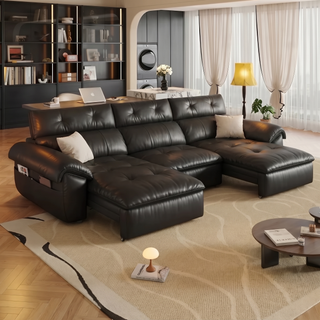 Black leather power sofa bed in a living room