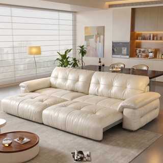 Cream leather power sofa bed in a living room