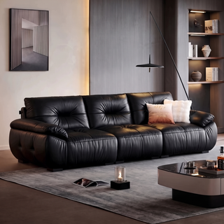 Black pleated leather sofa in a living room