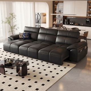 Black leather power sofa bed in a living room