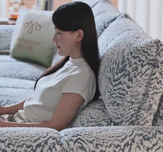 Two-tone power recliner sofa in use